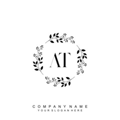 letter AT surrounded by beautiful and elegant flowers and leaves. Wedding monogram logo template. Fashion Logo template Vectors,
