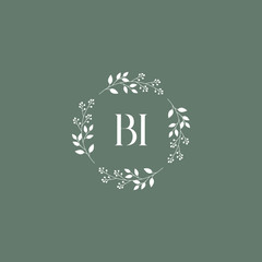 letter BI surrounded by beautiful and elegant flowers and leaves. Wedding monogram logo template. Fashion Logo template Vectors,