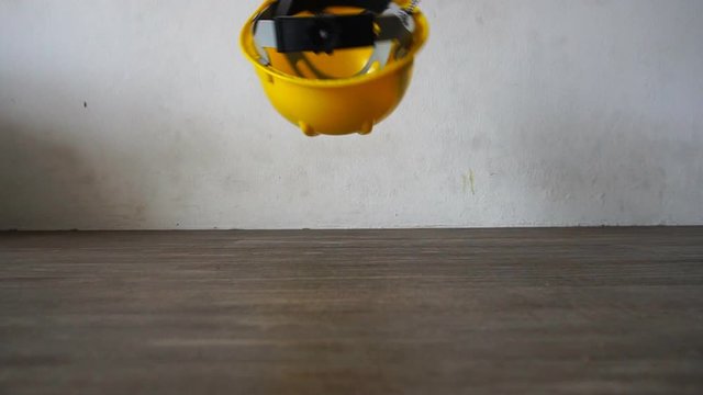 Safety hat falls on the ground