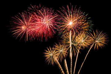 The colorful of fireworks showing on dark sky at night time for special celebration day with black background.