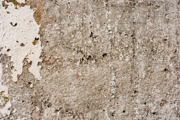 Texture of a concrete wall with cracks and scratches which can be used as a background