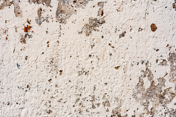 Texture of a concrete wall with cracks and scratches which can be used as a background