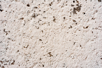 Texture of a concrete wall with cracks and scratches which can be used as a background