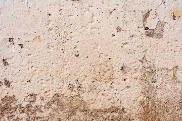 Texture of a concrete wall with cracks and scratches which can be used as a background