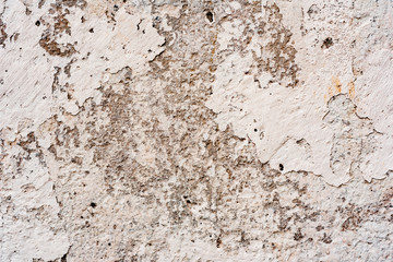 Texture of a concrete wall with cracks and scratches which can be used as a background
