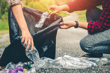 Women volunteer help garbage collection for to recycling environment.