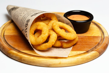 squid rings grilled on a wood