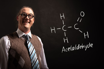 Professor presenting handdrawn chemical formula of acetaldehyde molecule