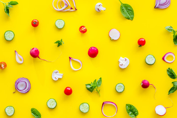 Cook pattern with fresh vegetables on yellow background top view