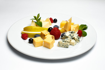 cheese plate with berries on a white