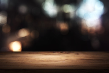 wooden table in front of blurred background of restaurant