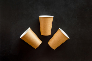 paper cups for coffee to take away on black background