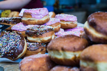 Decorated doughnuts at display in a food stall