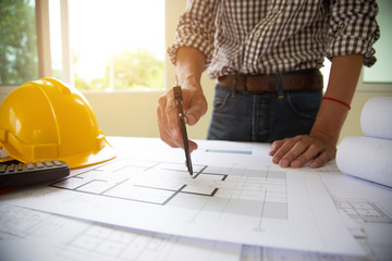 hand Engineers are writing home construction designs to bring them to prospective customers.concept