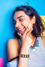 lifestyle people concept. young pretty smiling indian girl with long nails wearing lot of jewelry rings, asian summer happy cool close up