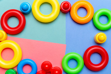 Fototapeta premium Colorful child kid’s education toys pattern background copy space on the bright background. Childhood infancy children babies concept