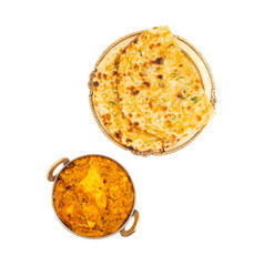 Indian Vegetarian Cuisine Special Sweet And Spicy Paneer Pasanda or Stuffed Paneer Curry, Delicacy Consisting of Stuffed Paneer with Rich Creamy Gravy Served With Garlic Naan on White Background