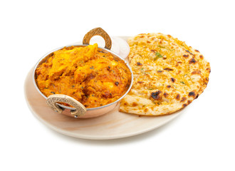 Indian Vegetarian Cuisine Special Sweet And Spicy Paneer Pasanda or Stuffed Paneer Curry, Delicacy Consisting of Stuffed Paneer with Rich Creamy Gravy Served With Garlic Naan on White Background