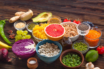 vegetables and healthy foods. variety of vegetables, fruits, nuts and legumes on a wooden background