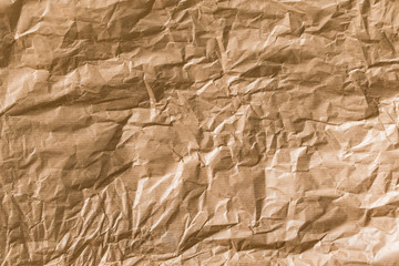 Crumpled brown kraft paper texture background.