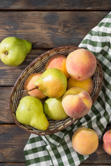 Pears in a basket on a wooden table. Rustic style