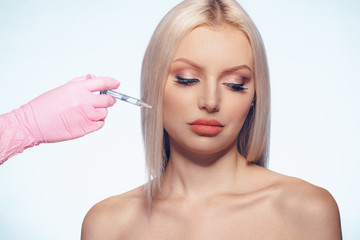 Naklejka premium Portrait of young Caucasian woman. Concept of botox cosmetic injection