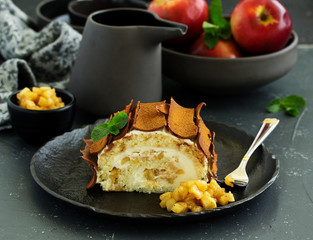 Roulade with apples and caramel, cream. New Year's dessert. Selective focus