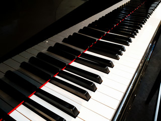 Piano keyboard side view.