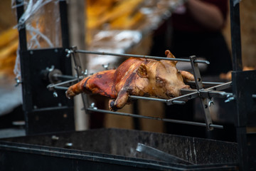 Suckling pig on a spit meat food health fat barbeq fire