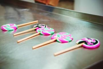 bright tasty organic lollipops lie on the table, close-up, hand made