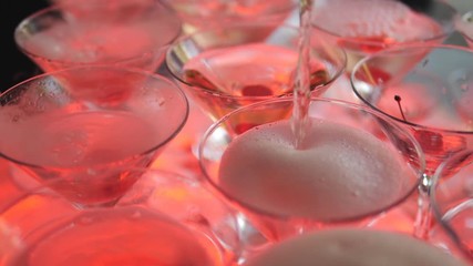 Close-up of the seething dry folk in champagne glasses on a buffet table in slow motion.