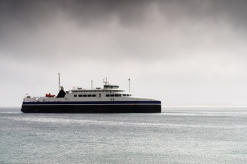 Fototapeta na wymiar Fjord with ferry boat, Norway.