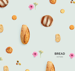 Creative layout made of bread and flowers. Flat lay. Food concept. Macro  concept.