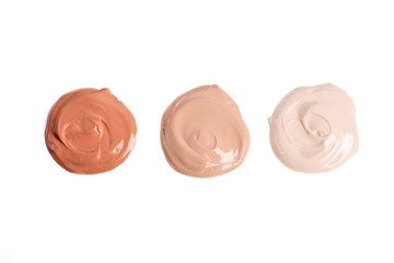 Round swatches of liquid makeup foundation