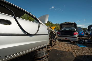 Fototapeta na wymiar Scrapped cars in a junk yard