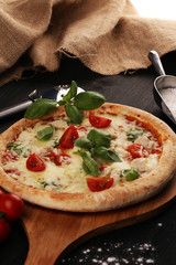 vegetarian italian Pizza with tomatoes, mozzarella cheese  and basil. Delicious italian pizza