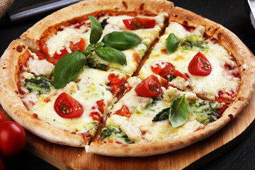 vegetarian italian Pizza with tomatoes, mozzarella cheese  and basil. Delicious italian pizza