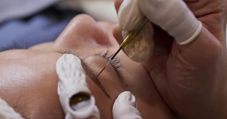 Woman having microblading in the beauty salon