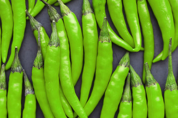 Hot green pepper. Chilean pepper on a black.
