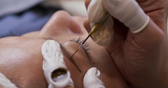 Woman having microblading in the beauty salon