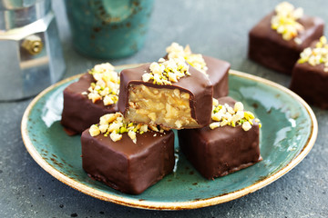 Homemade candy roasted with nuts and caramel. Selective focus