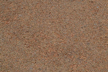 Closeup of beach with dark sand