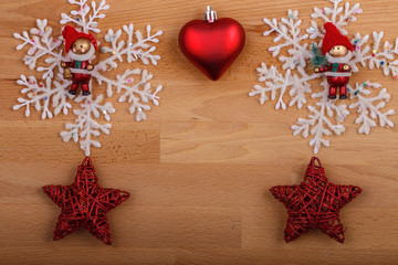 Christmas composition with toy snowflake, star and fir cones on a colored background