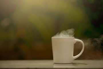 white cup of coffee and smoke.