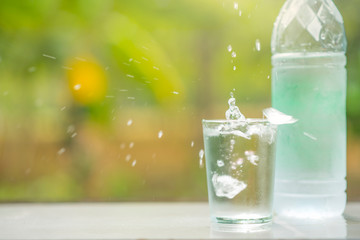 A glass of clean drinking water and spill