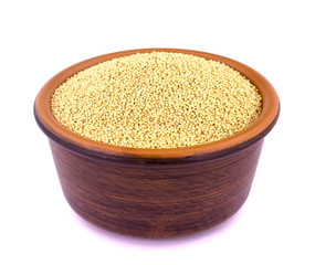 Amaranth grain in ceramic bowl isolated on a white background.