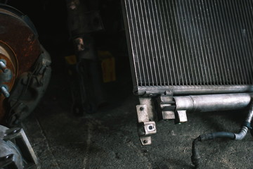 Close up of old radiator car preparing for repair in the garage.