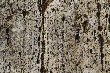 Detail of an old wall eroded by water