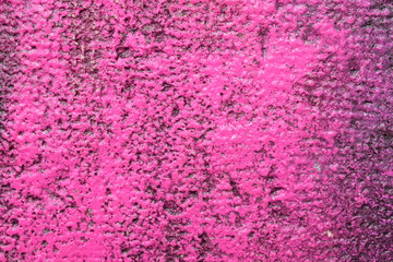Detail of an old marble wall painted in lilac to be used as a background