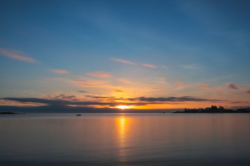 Fototapeta na wymiar Nostalgic Feel going into sunset. Sun burst at Sunset at Anse Vata Bay in Noumea, New Caledonia, French Polynesia, South Pacific.